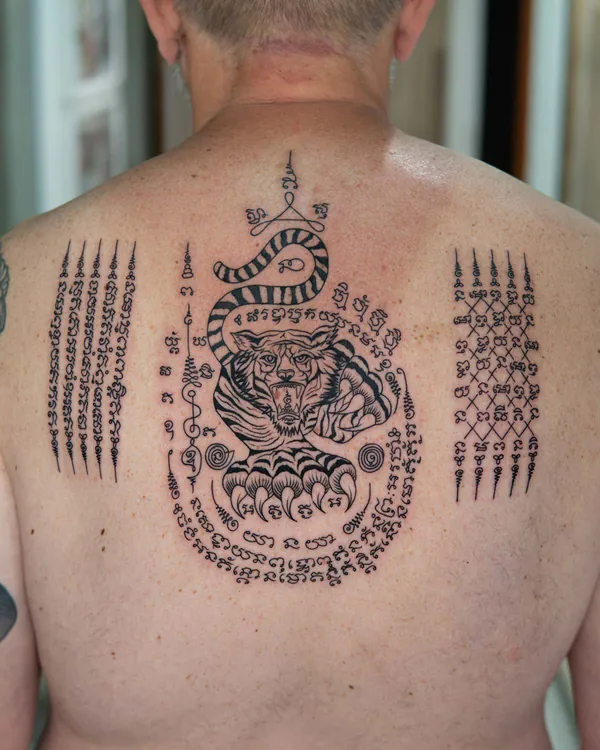 Tiger naga hybrid upper back Sak Yant tattoo Bangkok