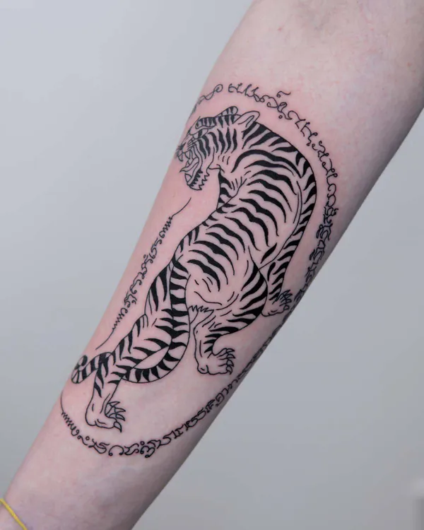Tiger circular script forearm Sak Yant tattoo Bangkok