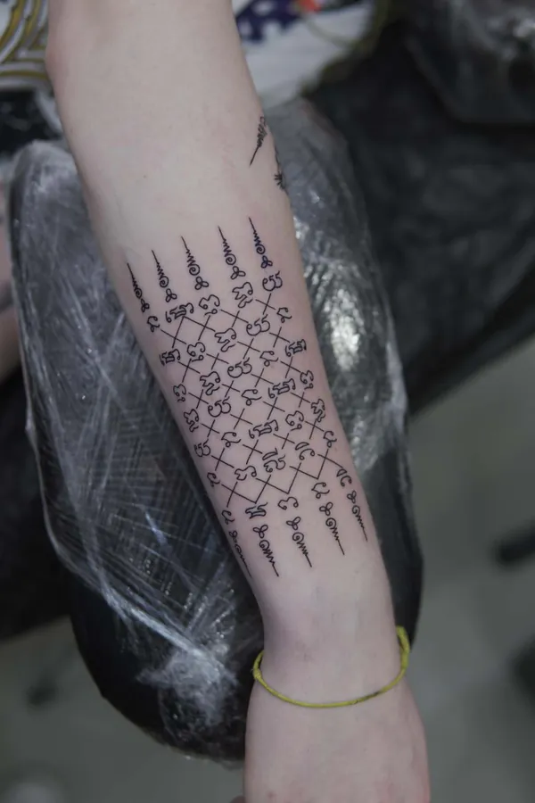 Geometric grid yant forearm Sak Yant tattoo Bangkok