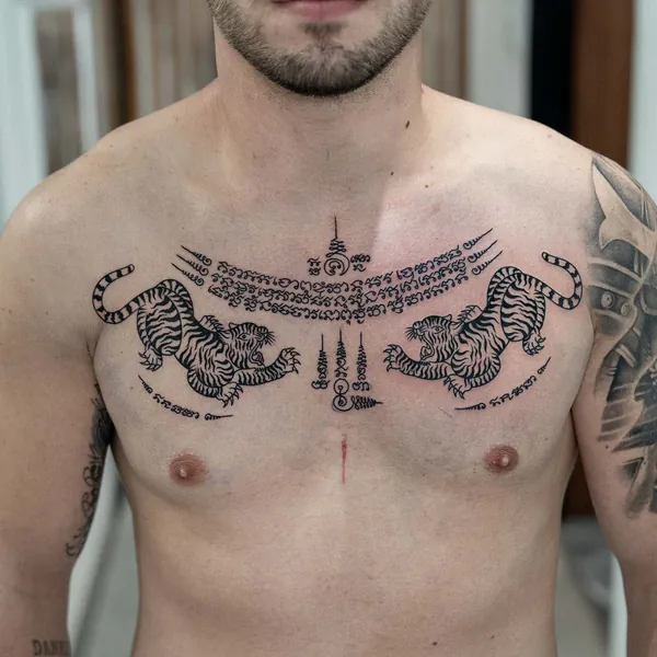 Twin tigers chevron collarbone Sak Yant tattoo Bangkok
