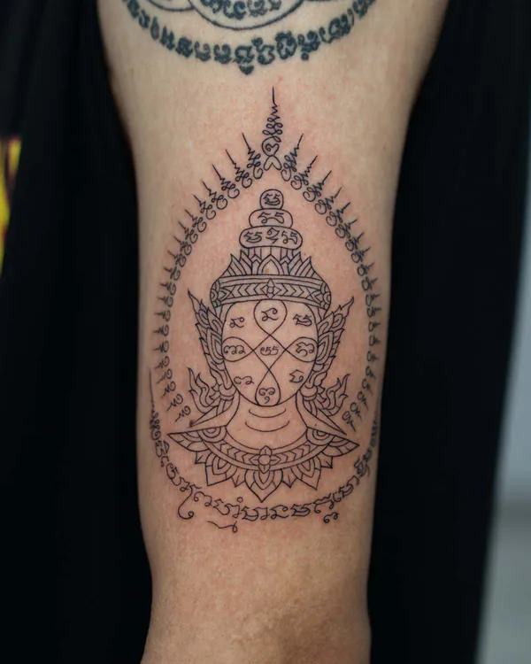 Deity face yant teardrop arm Sak Yant tattoo Bangkok