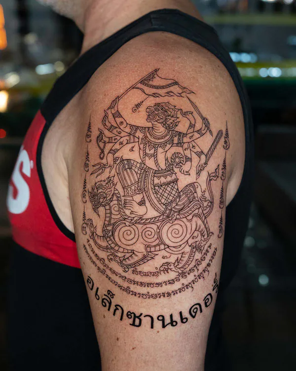 Warrior deity naga mount shoulder Sak Yant tattoo Bangkok