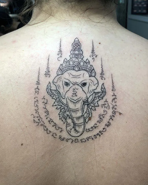 Elephant deity crowned upper back Sak Yant tattoo Bangkok