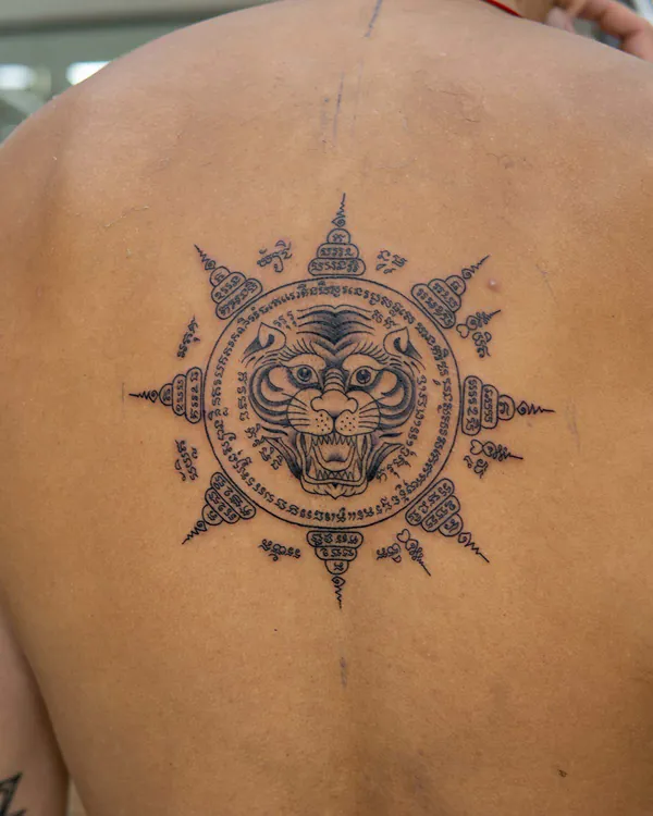 Tiger face sunburst medallion back Sak Yant tattoo Bangkok