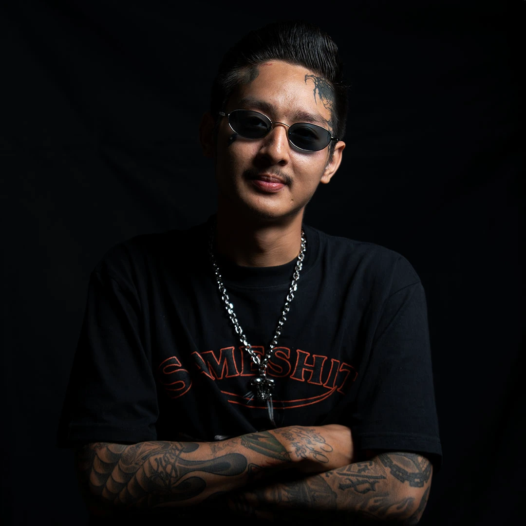 Yhee, chicano calligraphy tattoo artist at BKK INK Tattoo Studio Bangkok