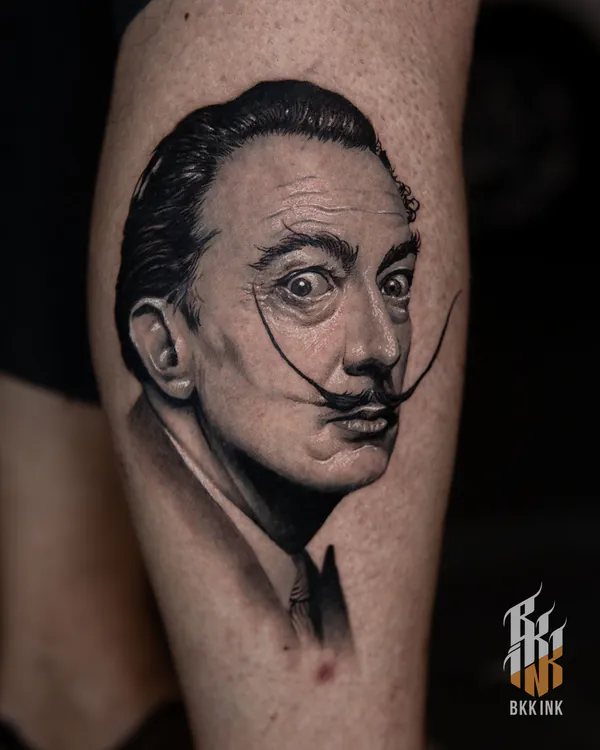 Salvador Dali portrait calf tattoo Bangkok by Zia