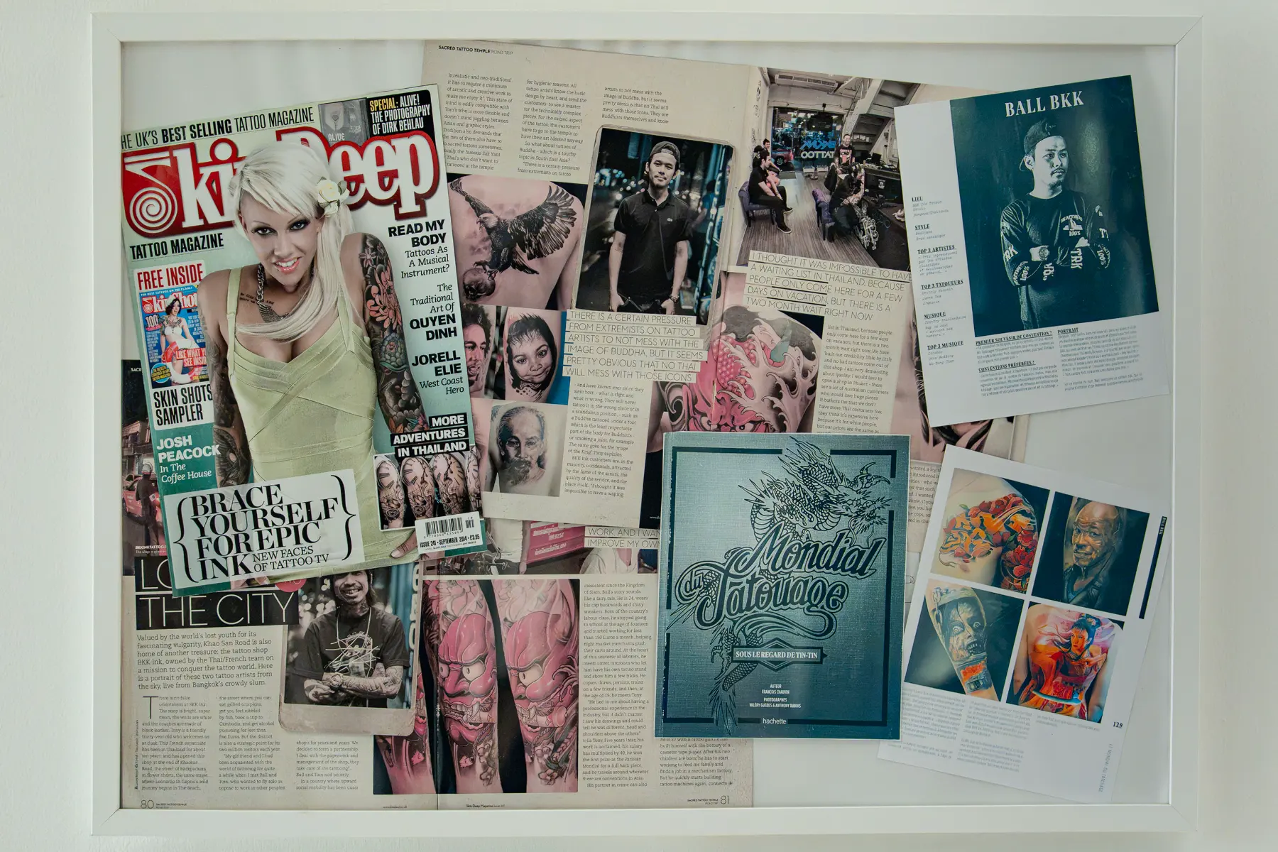 Skin Deep issue 241 feature and the Hachette Mondial du Tatouage book page on Ball BKK, framed at the studio