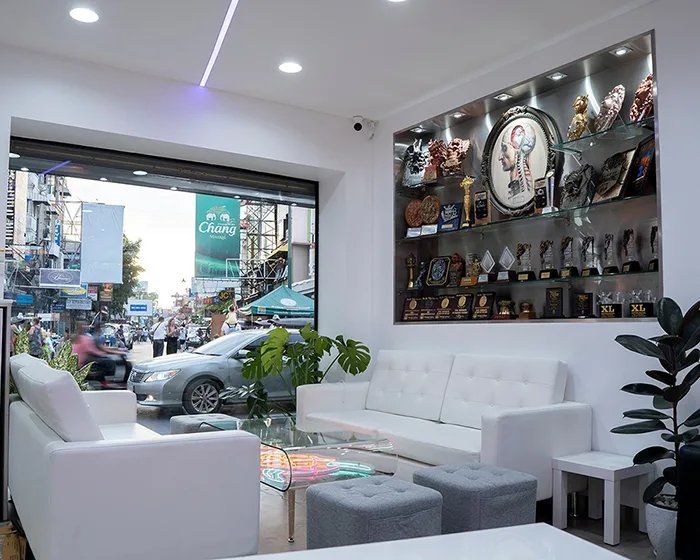 Trophy wall with international tattoo awards inside BKK INK studio on Khaosan Road